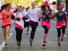 People approach the finish line during the Canadian Breast Cancer Foundation Run for the Cure in downtown Edmonton, Alta., on Sunday, Oct. 5, 2014. Codie McLachlan/Edmonton Sun/QMI Agency