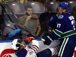 Edmonton Oilers' Connor McDavid gets hit by Vancouver Canucks Jake Virtanen (77) during the Young Star game at Penticton, BC on September11 2015. Perry Mah/Edmonton Sun/Postmedia Network