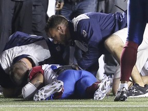 Staff attend to Montreal Alouettes' Jonathan Hefney after he was injured during the first half of their CFL football game against the Ottawa RedBlacks at TD Place Oct. 1, 2015. REUTERS/Chris Wattie