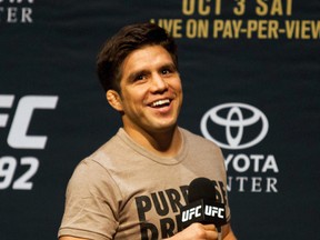 UFC Flyweight fighter Henry Cejudo smiles while taking questions from fans during a UFC 192 press conference in Houston on Friday, Oct. 2, 2015. (AP Photo/Juan DeLeon)