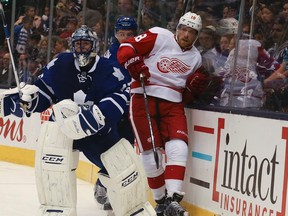 Maple Leafs goalie Johnathan Bernier clears the puck from behind the net against the Detroit Red Wings on Saturday night at the Air Canada Centre.It was Toronto's final pre-season game. (Veronica Henri/Toronto Sun)