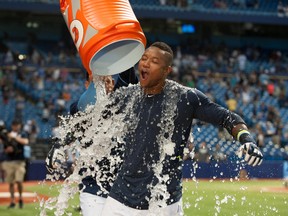 Tampa Bay Rays second baseman Tim Beckham (1) has ice dumped on him by short stop Asdrubal Cabrera (13) after hitting a walk-off single to win the game against the Toronto Blue Jays against the Toronto Blue Jays at Tropicana Field. (Jeff Griffith/USA TODAY Sports)