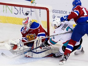 Edmonton Oil Kings’ goalie Patrick Dea makes a save against the Kelowna Rockets’ Riley Stadel (3) during Friday’s WHL game at Rexall Place (David Bloom, Edmonton Sun).