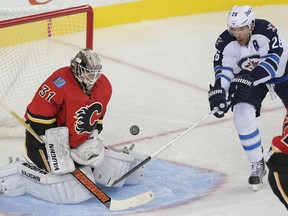 Blake Wheeler scores on the Flames on Saturday. (STUART DRYDEN/Calgary Sun)