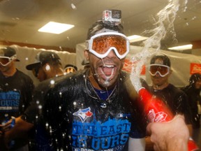 Toronto Blue Jays pitcher David Price celebrates with teammates after the second baseball game of a doubleheader against the Baltimore Orioles, Wednesday, Sept. 30, 2015, in Baltimore. Toronto clinched the American League East after winning the first game 15-2. (AP Photo/Patrick Semansky)