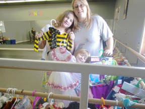 Sarah Allen, with children Megan Allen, left, and Abby Allen, hosted a free costume exchange Sunday afternoon at Diamond Dance Centre in Ingersoll. (HEATHER RIVERS/WOODSTOCK SENTINEL-REVIEW)