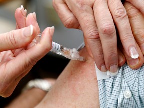 A flu shot is given.(Postmedia Network files)