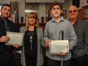 Jacob Lewis, left and Oscar Evans, second from right, are the recipients of the first Richard Baldwin Memorial Scholarship, presented by Janet Baldwin during the Kingston Musicians' Union's general meeting at the Royal Canadian Horse Artillery Club on Sunday. On the right is Gene Richard, president of the Kingston Musicians' Union. (Julia McKay/The  Whig-Standard)