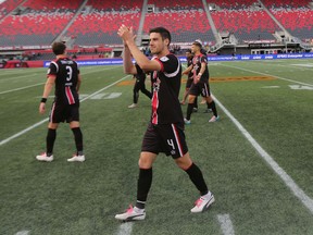 Ottawa Fury FC midfielder Drew Beckie celebrates clinching a playoff spot with a win over FC Edmonton at TD Place on Sunday, Oct. 4, 2015. (Chris Hofley/Ottawa Sun)