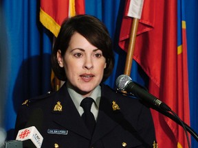 In this file photo, Royal Canadian Mounted Police (RCMP) Corporal Catherine Galliford speaks at a Vancouver news conference March 10, 2004, where it was announced that pork products processed and distributed from the farm of accused Canadian serial killer Robert Pickton may have contained human remains. REUTERS/Nick Didlick