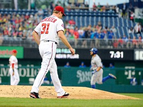 Washington Nationals starting pitcher Max Scherzer (31) reacts as Toronto Blue Jays center fielder Kevin Pillar (right) rounds the bases after hitting a solo home run during the second inning in game two of a double header at Nationals Park. Brad Mills-USA TODAY Sports