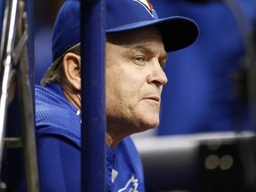 Manager John Gibbons #5 of the Toronto Blue Jays looks on from the dugout at the start of the first inning of a game against the Tampa Bay Rays on October 2, 2015 at Tropicana Field in St. Petersburg, Florida.   Brian Blanco/Getty Images/AFP