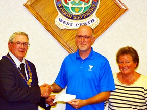 West Perth Mayor Walter McKenzie presents Dan Walker, a supervisor at the West Perth Youth Centre, and Mimi Price, the CEO of the Stratford-Perth YMCA, with a cheque for $6,500 to go toward providing at-risk youth in West Perth a safe place to socialize, learn life skills and have fun. GALEN SIMMONS/MITCHELL ADVOCATE