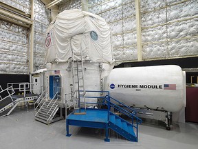 This Nov. 15, 2013 photo released by NASA shows the three-storey Human Exploration Research Analog habitat at the Johnson Space Center in Houston. The space agency, which is contemplating a future journey to Mars, is working with a military laboratory at the submarine base in Groton, Conn., to measure how teams handle stress during month-long simulations of space flight. (Bill Stafford/NASA via AP)