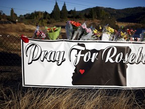 Memorial flowers are seen outside Umpqua Community College in Roseburg, Oregon, United States, Oct. 2, 2015.  REUTERS/Lucy Nicholson