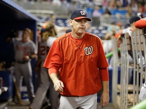 In this photo taken Sept. 13, 2015, Washington Nationals manager Matt Williams walks in the dugout during a baseball game against the Miami Marlins in Miami. The Washington Nationals say they have fired Matt Williams and his coaching staff.  (AP Photo/Lynne Sladky)