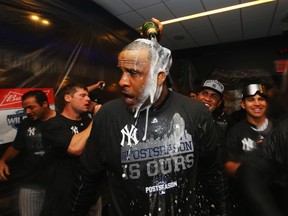 CC Sabathia of the New York Yankees celebrates their wildcard playoff berth at Yankee Stadium on October 1, 2015 in New York City. (Al Bello/Getty Images/AFP)