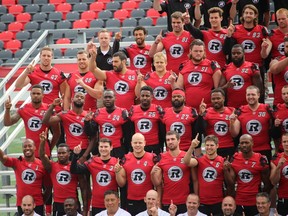 The RedBlacks had their team picture taken following a walk-through practice Monday at TD Place. (TIM BAINES/OTTAWA SUN)