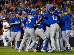 Toronto Blue Jays celebrate on the field after clinching the A.L East division at Oriole Park at Camden Yards. Toronto Blue Jays defeated Baltimore Orioles 15-2. Tommy Gilligan/USA TODAY Sports