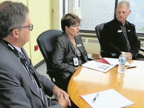 Luke Hendry/the Intelligencer
Quinte Health Care president and CEO Mary Clare Egberts announces funding cuts and restructuring for the four-hospital corporation during a press conference at Belleville General Hospital in Belleville Monday. Flanking her were vice-chairman Doug McGregor, left, and chief of staff Dr. Dick Zoutman.