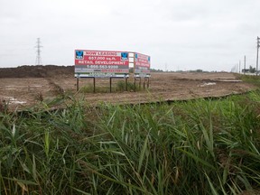 A sign stands on the northwest corner of Wonderland and Exeter Roads where York Commercial Development is building a major commercial plaza in London, Ont. on Sunday October 4, 2015. (CRAIG GLOVER, The London Free Press)