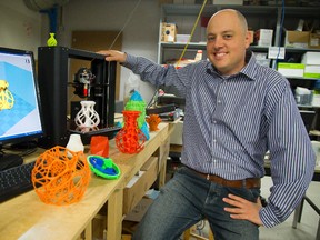 Shachar Weis, seen in the unLab, is running an after-school program to teach teens about 3D printing. (MIKE HENSEN, The London Free Press)