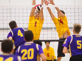 Central?s Ethan Jones can?t get a spike past the block of Alen Dautovich and Tyler Roberts of Saunders during their TVRA Central senior boys volleyball match at Saunders on Monday. The Sabres won 25-9, 25-21, 25-17.(MIKE HENSEN, The London Free Press)