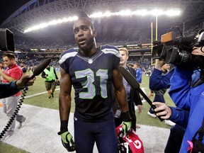 Seahawks strong safety Kam Chancellor walks off the field after the Seahawks beat the Lions 13-10 in Seattle on Monday, Oct. 5, 2015. (Elaine Thompson/AP Photo)