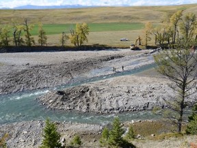 A landowner north of Cowley went into the Oldman River on Sept. 21, leaving behind tread marks on the river bank and a new channel to divert the water. David McIntyre photo/Submitted