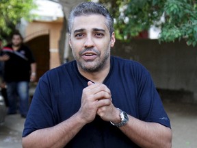 Al Jazeera television journalist Mohamed Fahmy reacts and celebrates after being released from Tora prison, in Cairo, Egypt, on Sept. 23, 2015. (REUTERS/Al-Youm Al-Saabi)