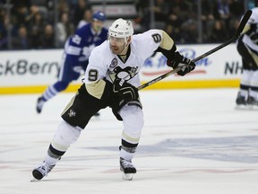 Pittsburgh Penguins forward Pascal Dupuis (9) heads up ice against the Toronto Maple Leafs at the Air Canada Centre. (John E. Sokolowski/USA TODAY Sports)