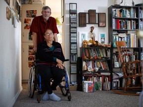 John Collins, a British veteran who served in Northern Ireland, is pictured with his wife Anne at home in Victoria, B.C., Thursday October 1, 2015. John is facing a bureaucratic battle to stay in Canada with his wife, and has looked at all of his legal options to remain. THE CANADIAN PRESS/Chad Hipolito