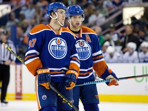 Edmonton Oilers' Connor McDavid and Taylor Hall during third period NHL action against the Vancouver Canucks at Rexall Place in Edmonton  on Thursday Oct. 1, 2015. (David Bloom/Edmonton Sun/Postmedia Network)