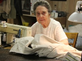 Dorothy Stute works on a coat at Beacon Cleaners on London Line Tuesday. The 88-year-old Sarnia steamstress has run the dry cleaning and alterations business for the last 62 years, taking in teenagers over the years to learn the trade. Barbara Simpson/The Observer/Postmedia Network