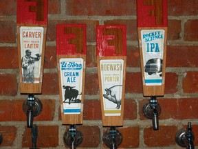 This undated photo provided by the Durham Convention & Visitors Bureau shows different types of beer on tap at the Fullsteam Brewery in Durham, N.C. Fullsteam stakes Durham’s claim to the craft beer boom. It’s part of downtown Durham’s blossoming as a destination. (Fullsteam Brewery and Durham Convention & Visitors Bureau via AP)
