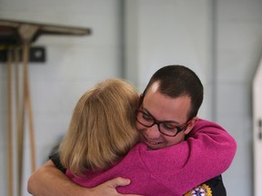 Sharon Smith hugs EMT Jason McNeil at Bonnie Doon EMS. Smith's visit was to thank the people who help save her life on October 6, 2015 in Edmonton, Alta. Perry Mah/Edmonton Sun