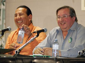 NDP candidate Rex Isaac, left, and Green candidate Jim Johnston chat prior to a health-care forum held at the Walpole Island Sports Complex on Oct 1. Both the Liberal and Conservative candidate did not show up to talk about health-care issues.