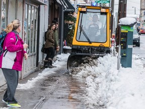 Sidewalk clearing is an example of a service that achieved savings under in-house programs, the union says. (Ottawa Sun Files)