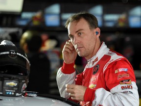 Kevin Harvick gets ready before practice for the NASCAR Sprint Cup race Saturday, Oct. 3, 2015, at Dover International Speedway in Dover, Del. (AP Photo/Nick Wass)