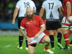 Canada's Ray Barkwill kneels on the pitch dejected after the Rugby World Cup Pool D match between Canada and Romania on Oct. 6. (The Associated Press)