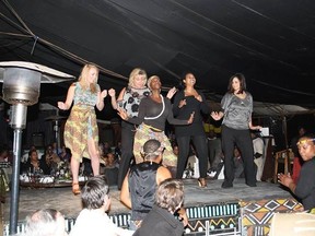 Ottawa Coun. Diane Deans is coming under fire after taking a trip to South Africa on taxpayers' dime while serving on the board of the Housing services Corp. in 2012.  Deans (second from left) is seen dancing on a stage during her trip. SUPPLIED PHOTO