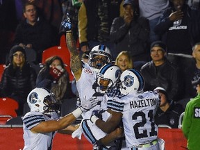 Argonauts' Chad Owens is hoisted in the air as he celebrates his game winning touchdown against the Ottawa Redblacks. The Argos defeated the Redblacks 38-35. (The Canadian Press)