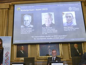 Professors Sara Snogerup Linse, Goran K. Hansson and Claes Gustafsson, members of the Nobel Assembly, talk to the media at a news conference at the Royal Swedish Academy in Stockholm Oct. 7, 2015. Sweden's Tomas Lindahl, the U.S.-based Paul Modrich and Turkish-born Aziz Sancar won the 2015 Nobel Prize for Chemistry for work on mapping how cells repair damaged DNA, the award-giving body said on Wednesday.  REUTERS/Fredrik Sandberg/TT News Agency