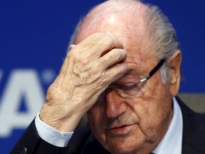 Re-elected FIFA President Sepp Blatter gestures during news conference after an extraordinary Executive Committee meeting in Zurich, Switzerland, in this May 30, 2015 file photo. (REUTERS/Arnd Wiegmann/Files)
