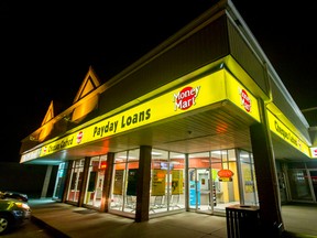 A Money Mart sits in the Forest Lawn area of Calgary, Alta., on Tuesday, Oct. 6, 2015. The provincial government plans to review payday loan regulations that are set to expire next year. Lyle Aspinall/Calgary Sun/Postmedia Network