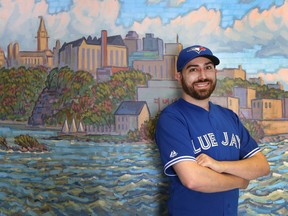 Andre Chapman poses for a photo at his office in Ottawa Ontario Wednesday Oct 7, 2015. Andre is a juror from an Ottawa trial who got excused so he could go watch the Jays play during their playoff run.  Tony Caldwell/Ottawa Sun/Postmedia Network
