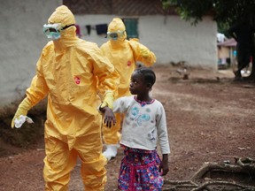 In this Tuesday, Sept. 30, 2014 file photo, Nine-year-old Nowa Paye is taken to an ambulance after showing signs of the Ebola infection in the village of Freeman Reserve, about 30 miles north of Monrovia, Liberia. The World Health Organization says there were no Ebola cases reported last week - the first time an entire week has passed without any new confirmed patients since the devastating outbreak began last March. The U.N. health agency said in a report issued Wednesday, Oct. 7, 2015 that all contacts of Ebola cases in Sierra Leone have now been followed for 21 days without falling sick, suggesting the country might soon be free of the disease.  (AP Photo/Jerome Delay, File)
