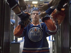Edmonton Oilers' Connor McDavid leaves the ice after being name the first star of the game as the Oilers defeated the Minnesota Wild in NHL pre-season hockey game in Saskatoon, Saturday, September 26, 2015. THE CANADIAN PRESS/Liam Richards