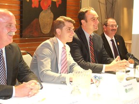 Conservative candidate Andy Brooke, left, Green party's Nathan Townend, Liberal Mark Gerretsen and NDP's Daniel Beals take their seats in Kingston, Ont. on Wednesday, Oct. 7, 2015 for an all-candidates meeting sponsored by the chamber of commerce. (Michael Lea/The Whig-Standard)