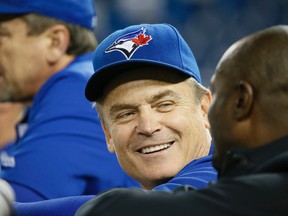 Toronto Blue Jays manager John Gibbons shares a laugh during batting practice at the Rogers Centre in Toronto on Oct. 7, 2015. (Stan Behal/Toronto Sun/Postmedia Network)